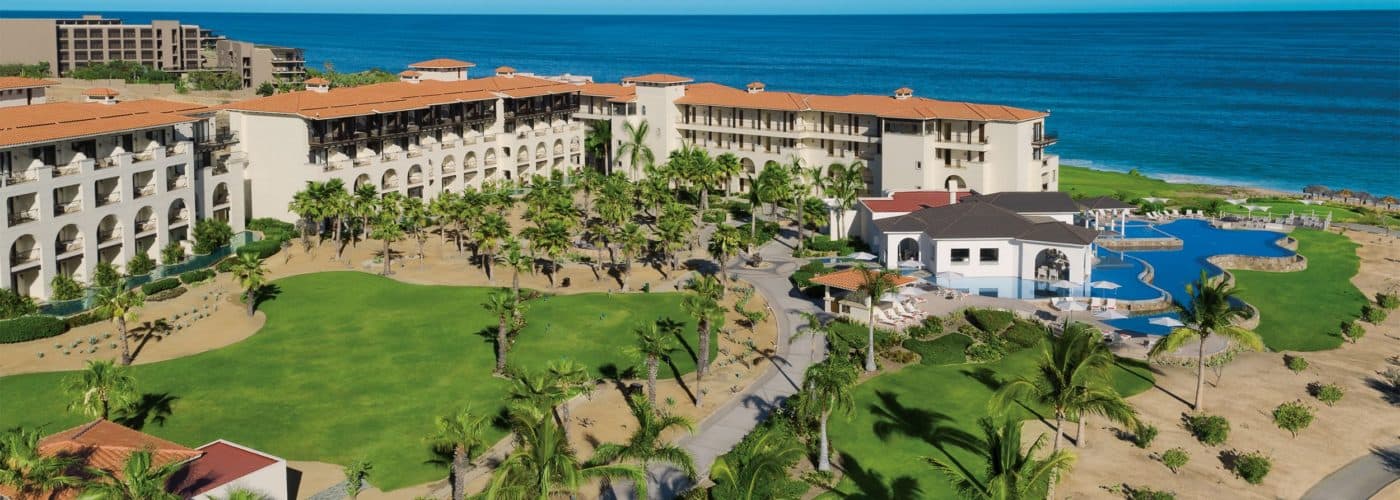 Secrets Puerto Los Cabos Golf Spa Resort aerial 1400x500 1